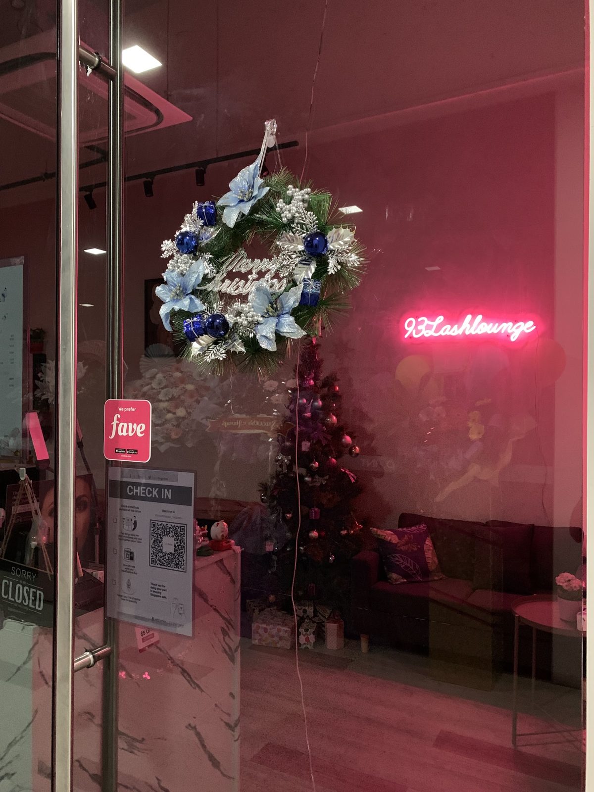 The shopfront with the neon lounge sign